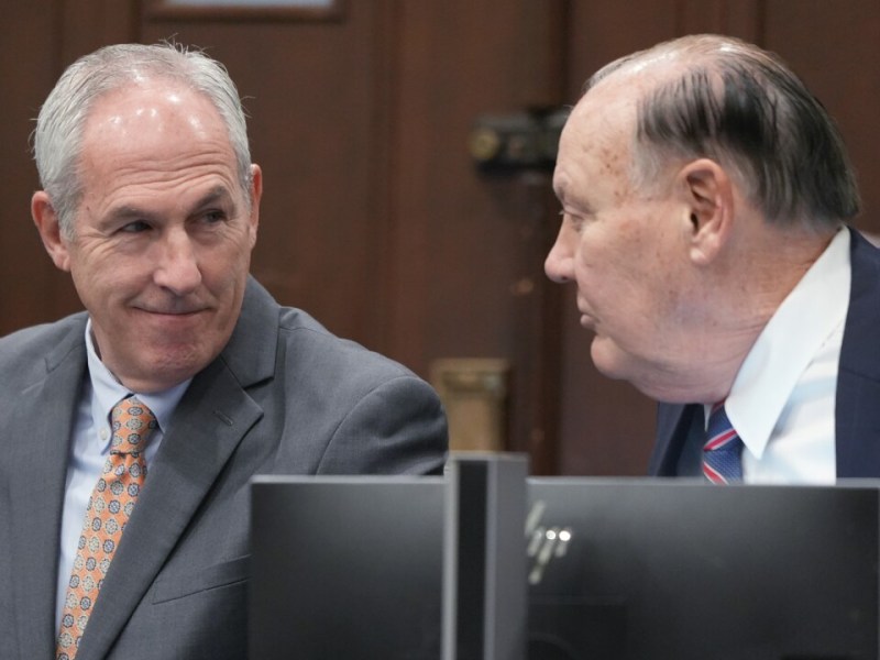 Two men in a courtroom.