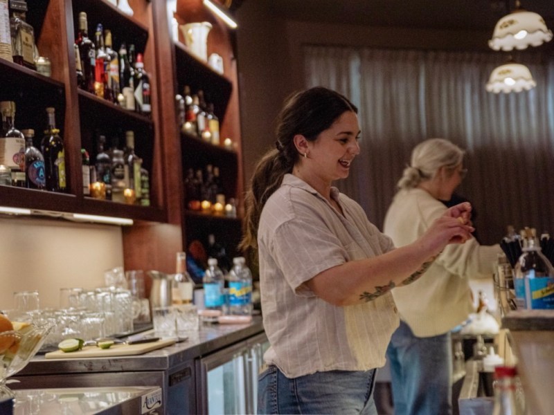 People behind a bar.